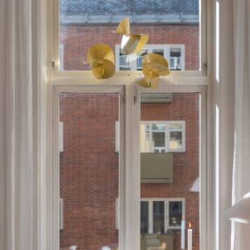 Tre av Kreftforeningens julestjerne i gull